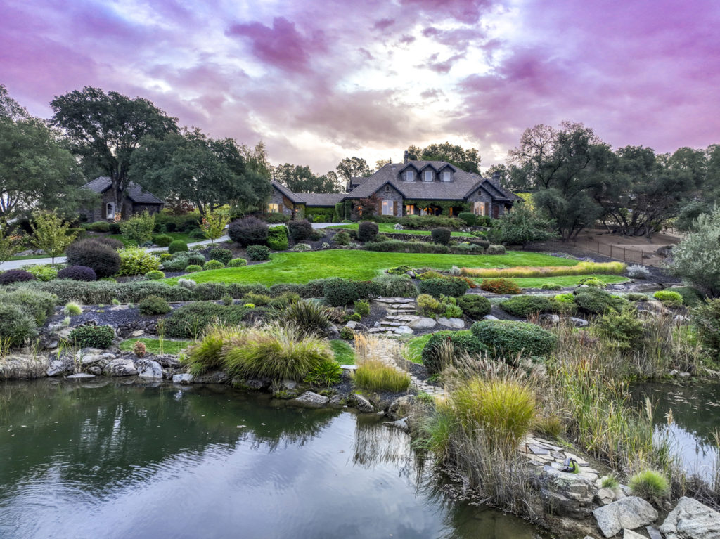 Experience Elegance and Comfort atop this Hillside Estate on the Cover