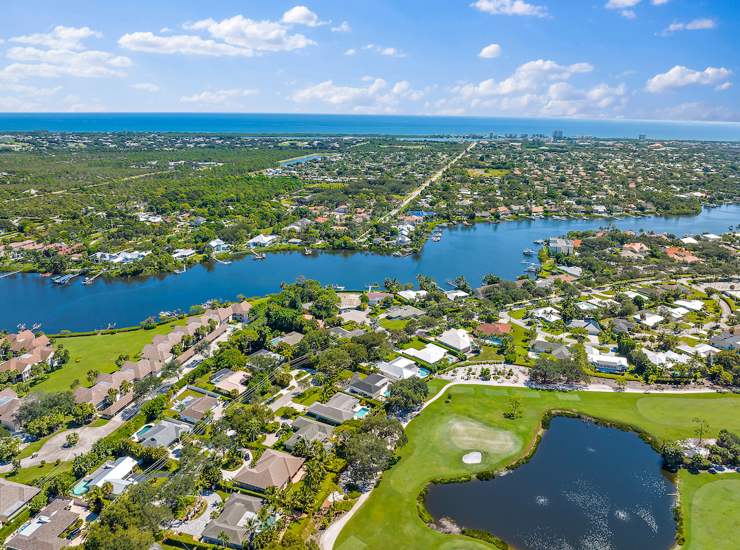 This updated and charming home offers amazing views over the 8th green and 9th fairway of the highly touted Tequesta Country Club!