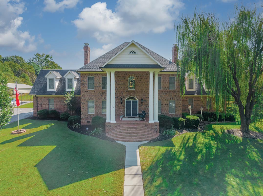 Charming Must-see Brick Home on 2.73 acres in Queens Cove!