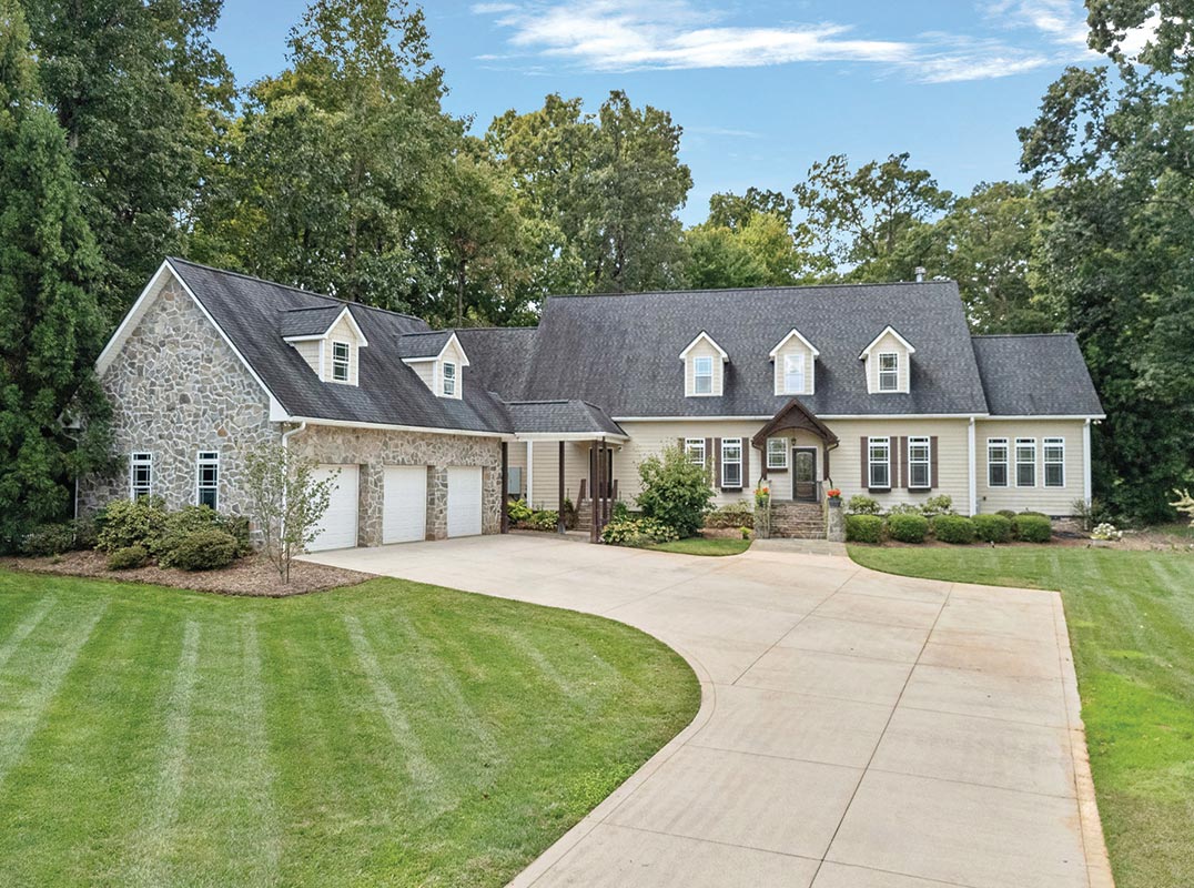Stunning Farmhouse on Over 10 Private Acres in Desirable Troutman