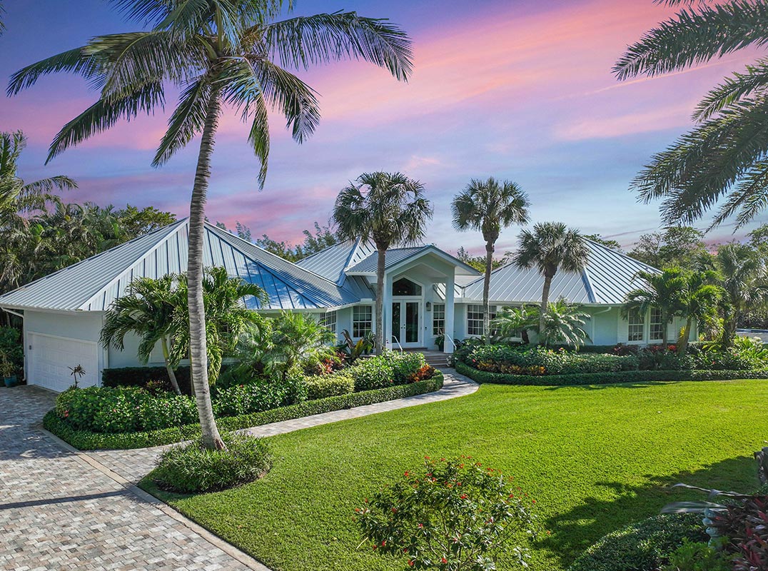 Tropical Landscaped Waterfront With Dock