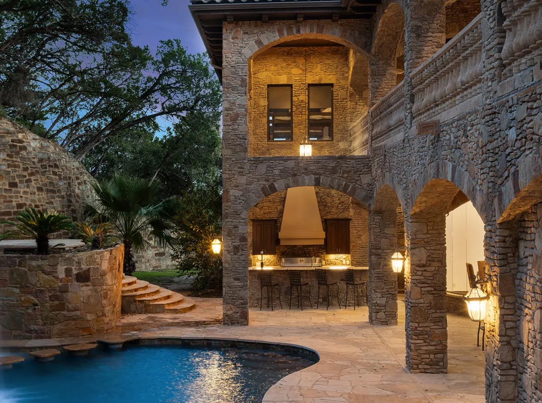 Exquisite West Lake Hills Estate with Breathtaking Water Features & Luxe Finishes