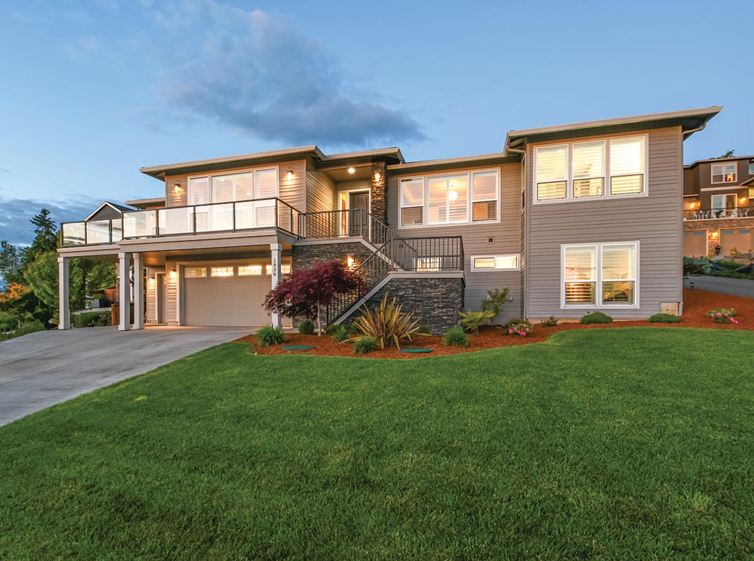 CUSTOM 4 BDRM HOME WITH STUNNING RIVER & CITY VIEWS!