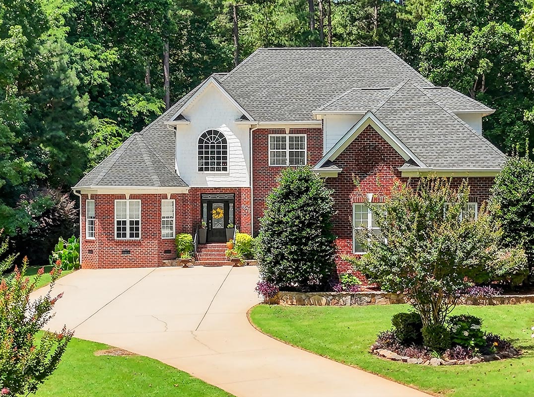 Custom Home Nestled on Lush Wooded Lot with Tranquil Waterviews
