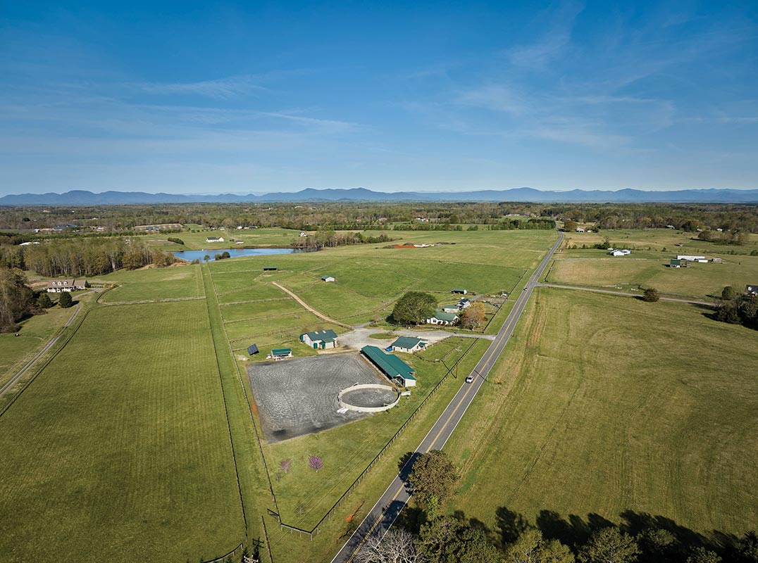1929 Home Nestled on 20 Fully Fenced Acres with 2 Barns